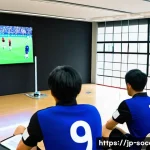 축구 심판 자격증 취득법 - A group of diverse Japanese soccer referees attending a training workshop in a modern sports hall, w...